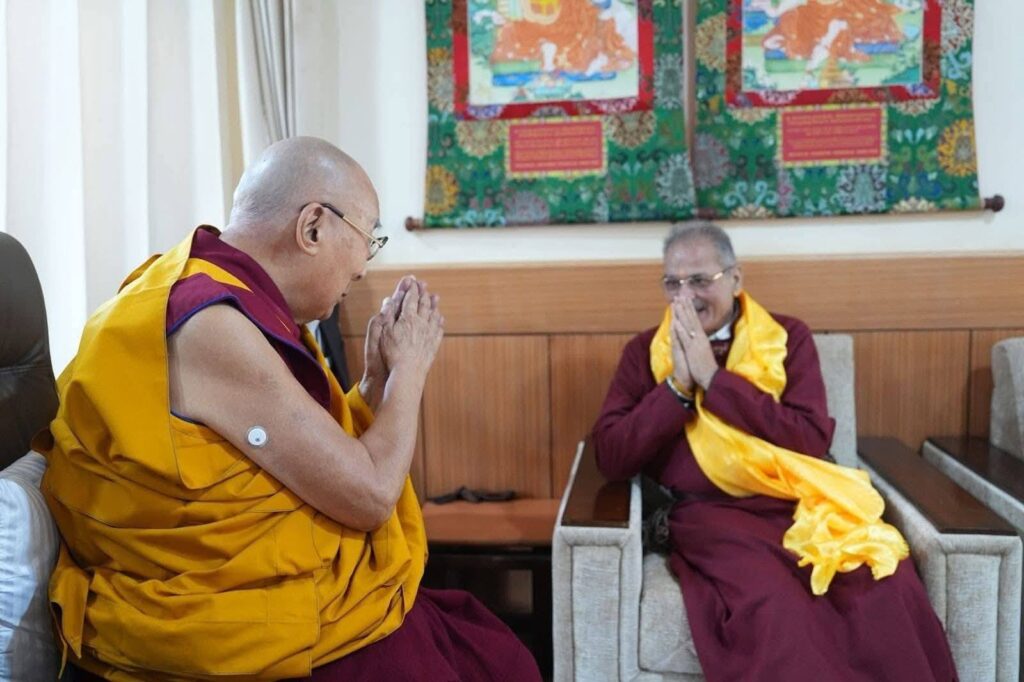 Kavinder Gupta shares a respectful greeting with the Dalai Lama during his visit to Leh.