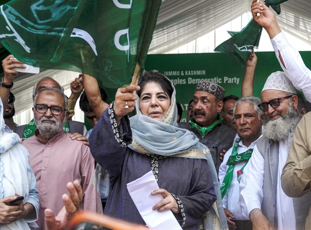 Mehbooba Mufti addressing PDP foundation day event in Srinagar, calls for India-Pakistan dialogue and end to war rhetoric.